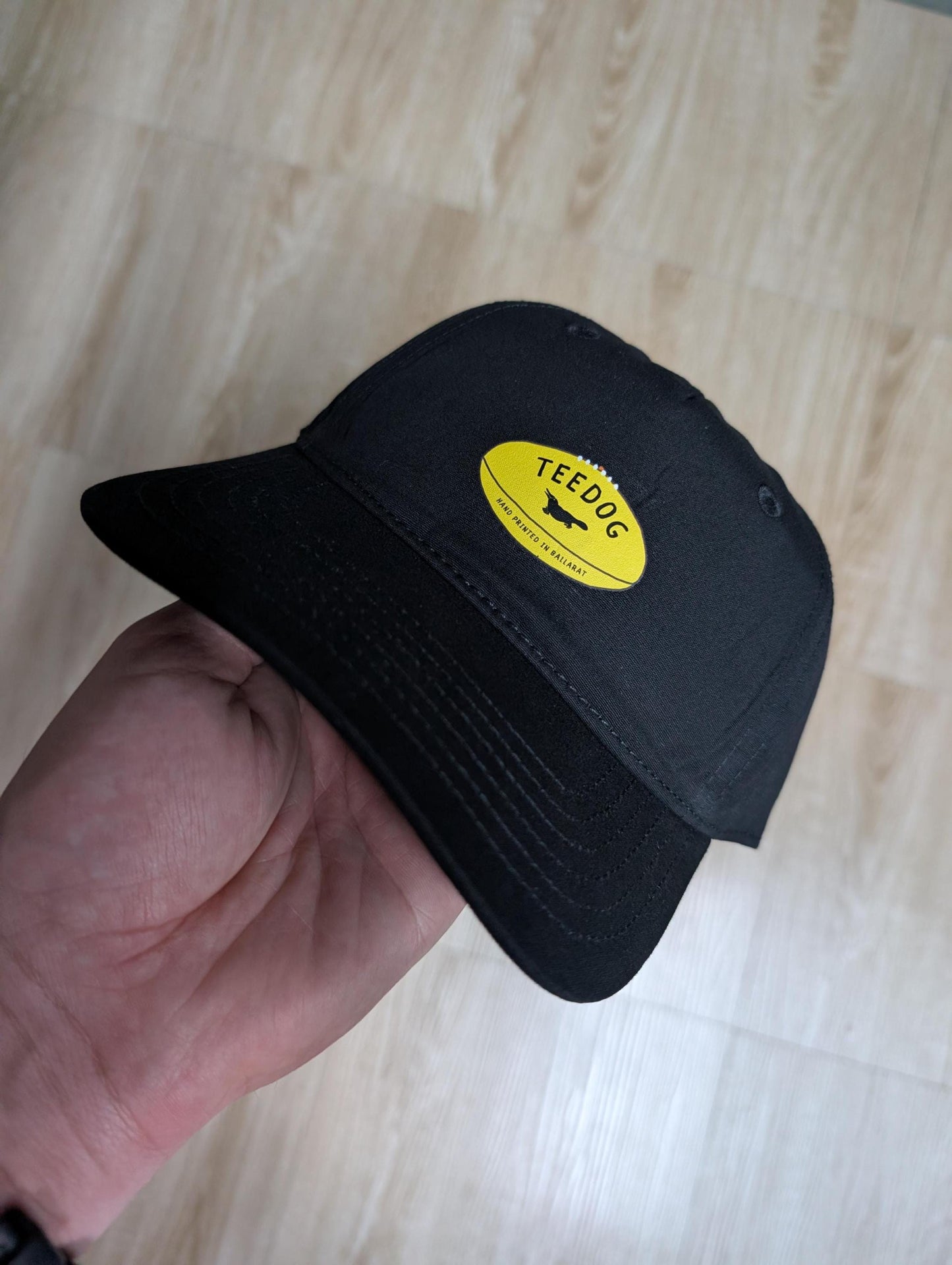 Aussie Rules Footy Hat – Yellow Football Logo Dad Cap – Hand Printed Black Headwear – Fan Gear for Men & Women – Aussie Rules Gift