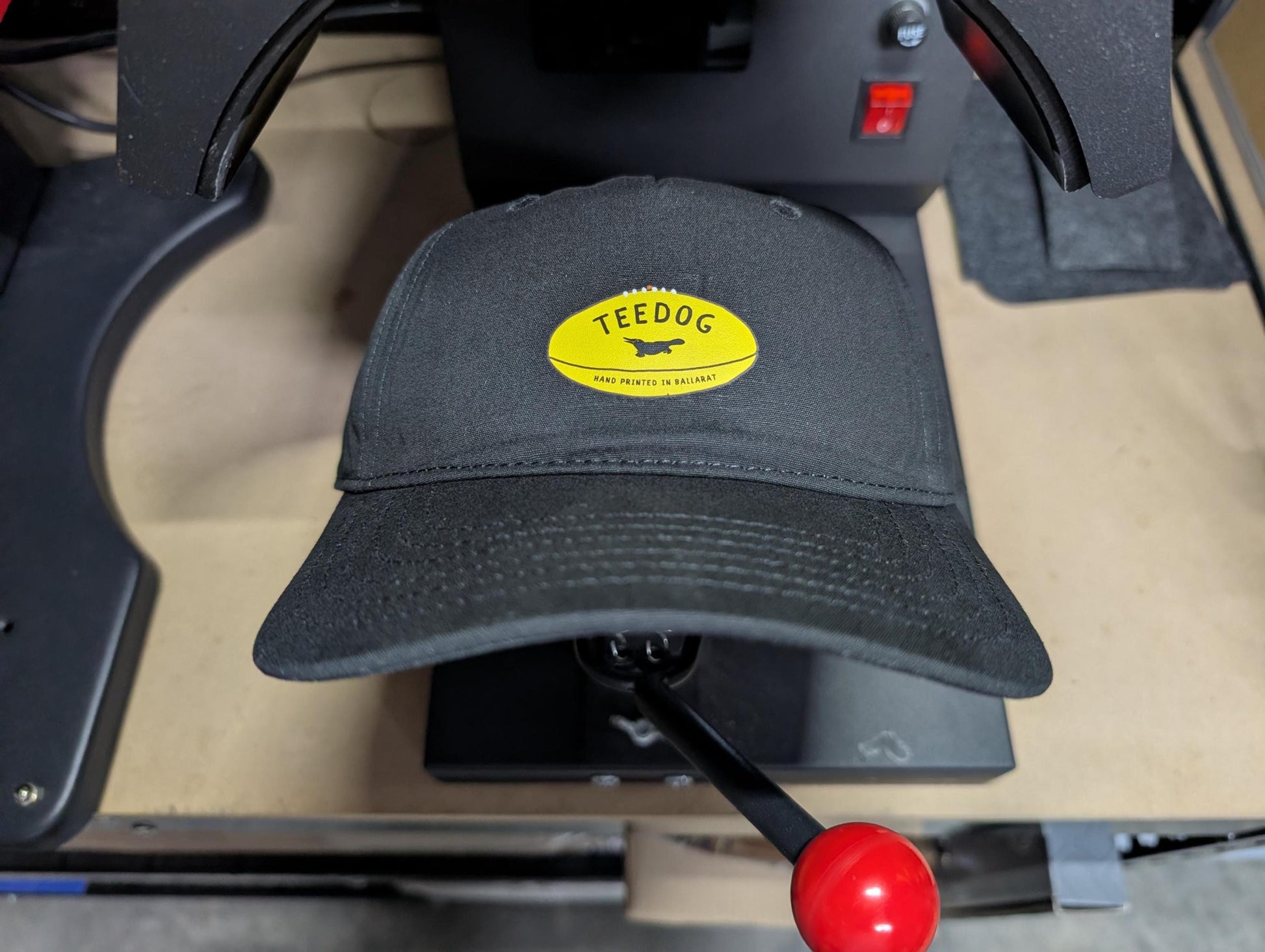 Aussie Rules Footy Hat – Yellow Football Logo Dad Cap – Hand Printed Black Headwear – Fan Gear for Men & Women – Aussie Rules Gift